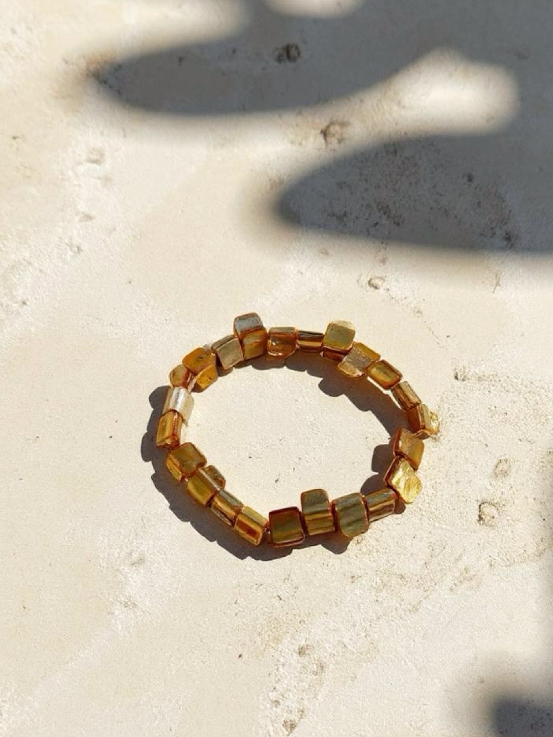 Gold mother of pearl bracelet is the perfect choice for beach vacation or every day wear. This seashell pearl bracelet is made using natural water fresh mother of pearl e for understated elegance. 