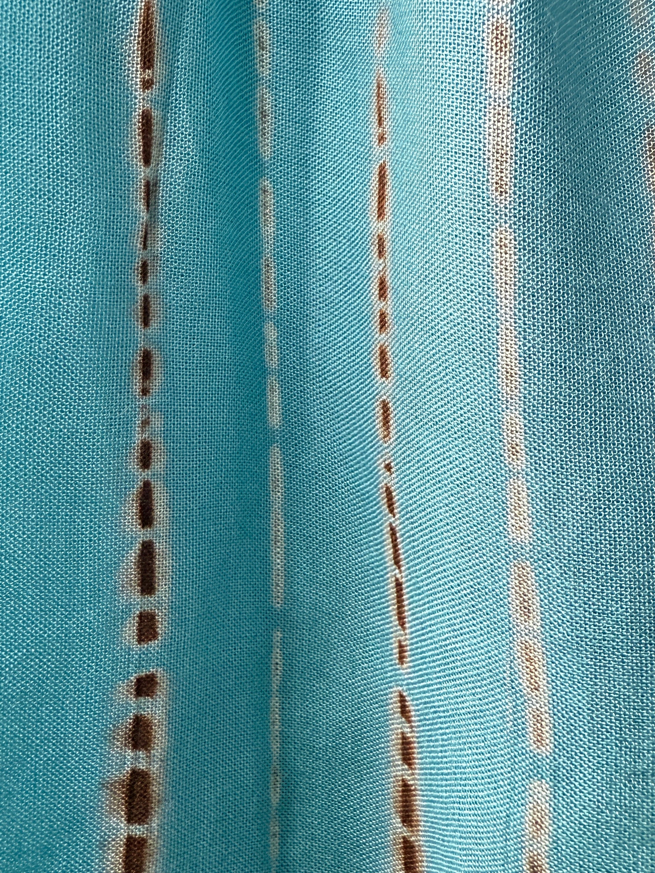 Showing fabric tie dye Kaftan Dress in teal—flowy tie-dye maxi dress with pockets, deep V-neckline, perfect for summer, resort wear, or festivals.