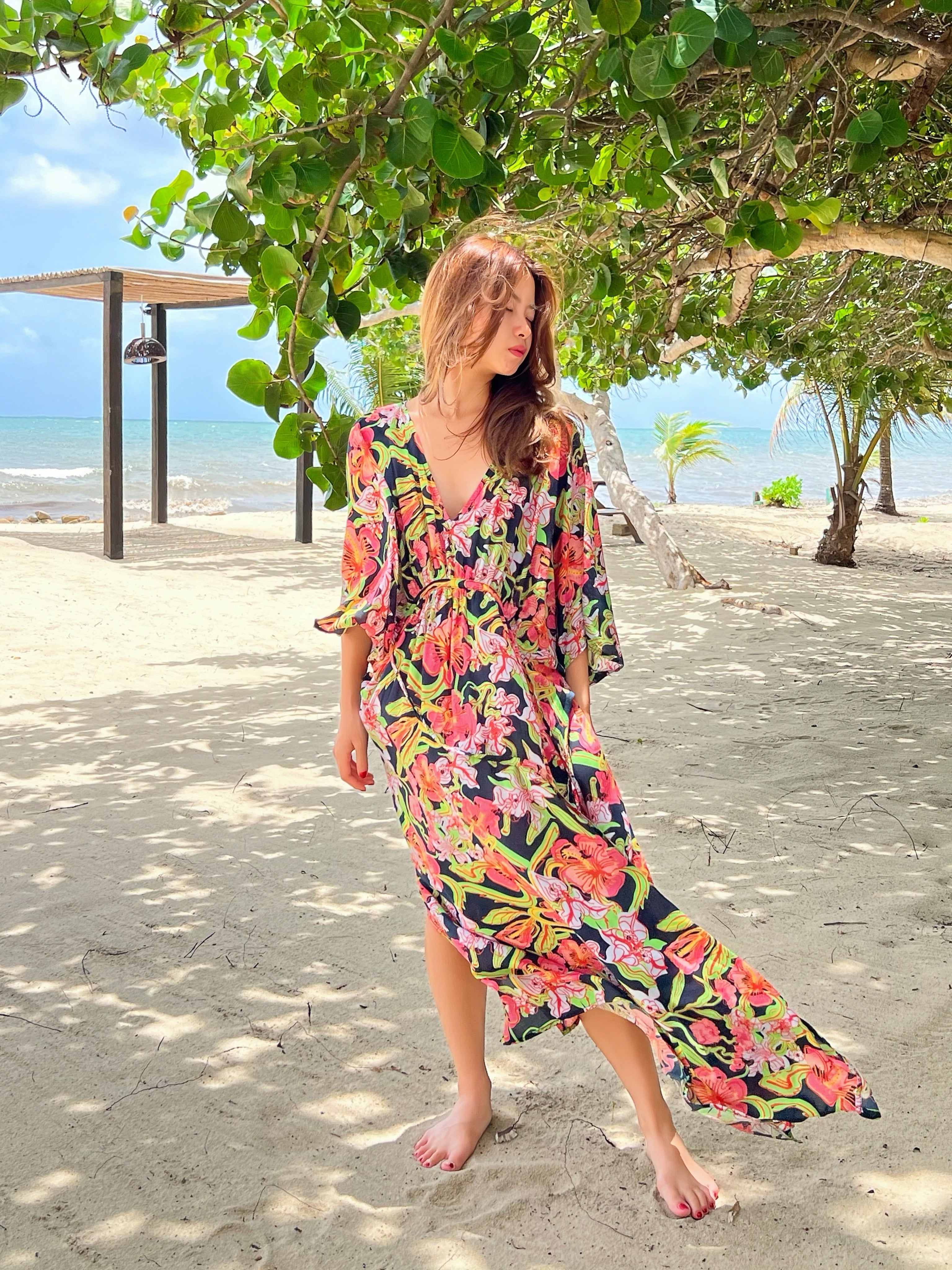 Discover the Kaftan in Tropical Flower Print—a striking fusion of vibrant color and meticulous design. Embrace the thrill of your upcoming escape with this chic and comfortable caftan, perfect for resort dress, cruise wear, party attire, and everyday elegance. Brought to you by Coco de Chom, this caftan is a stylish companion for various occasions.