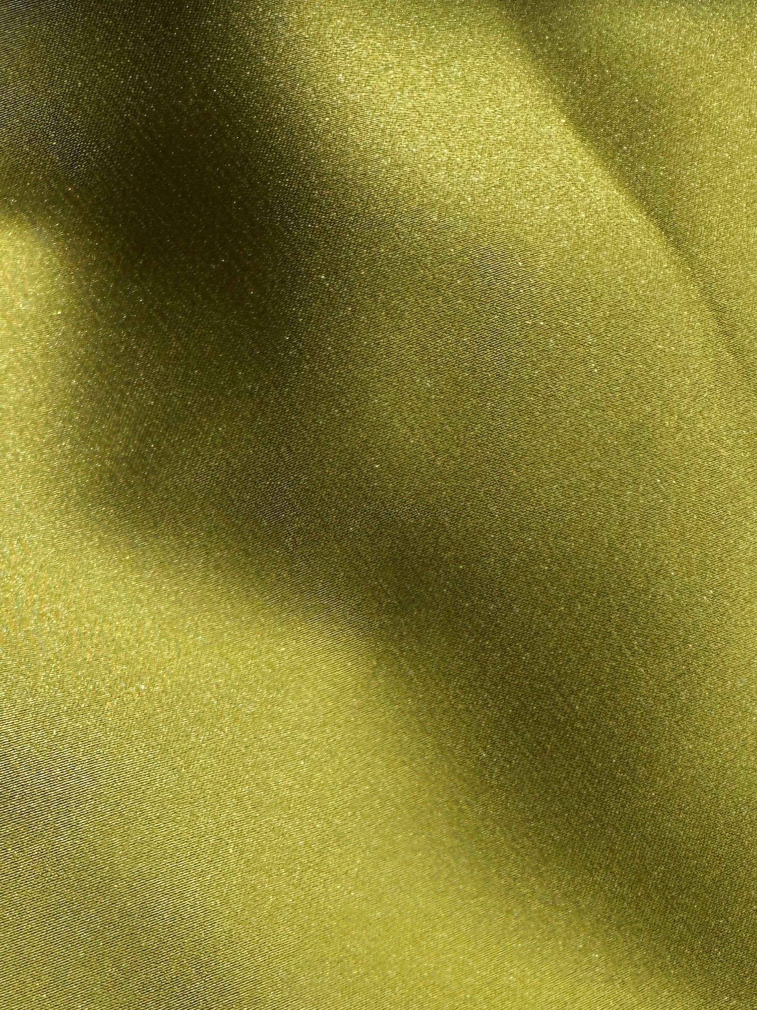 Close-up of green fabric with a textured surface