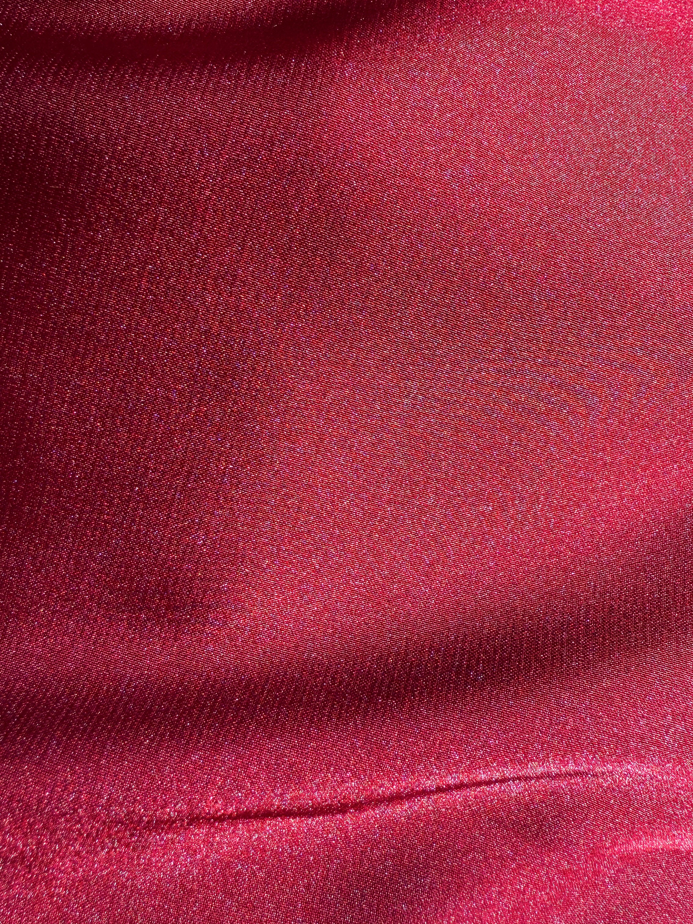 Close-up of red fabric with a textured pattern