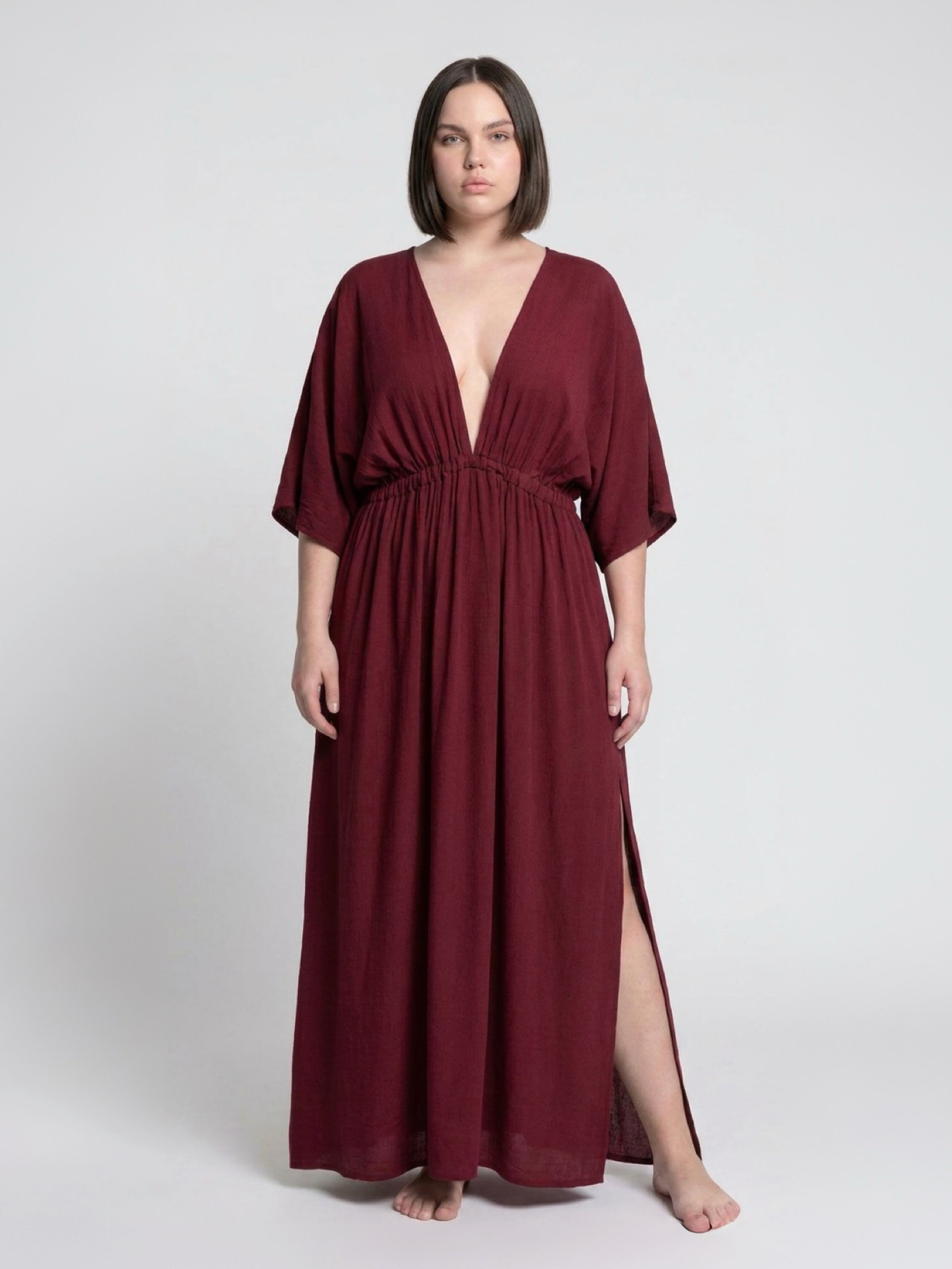 Burgundy Goddess Kaftan Dress worn as an oversized beach cover up, plus size friendly maternity caftan and boho resort maxi dress