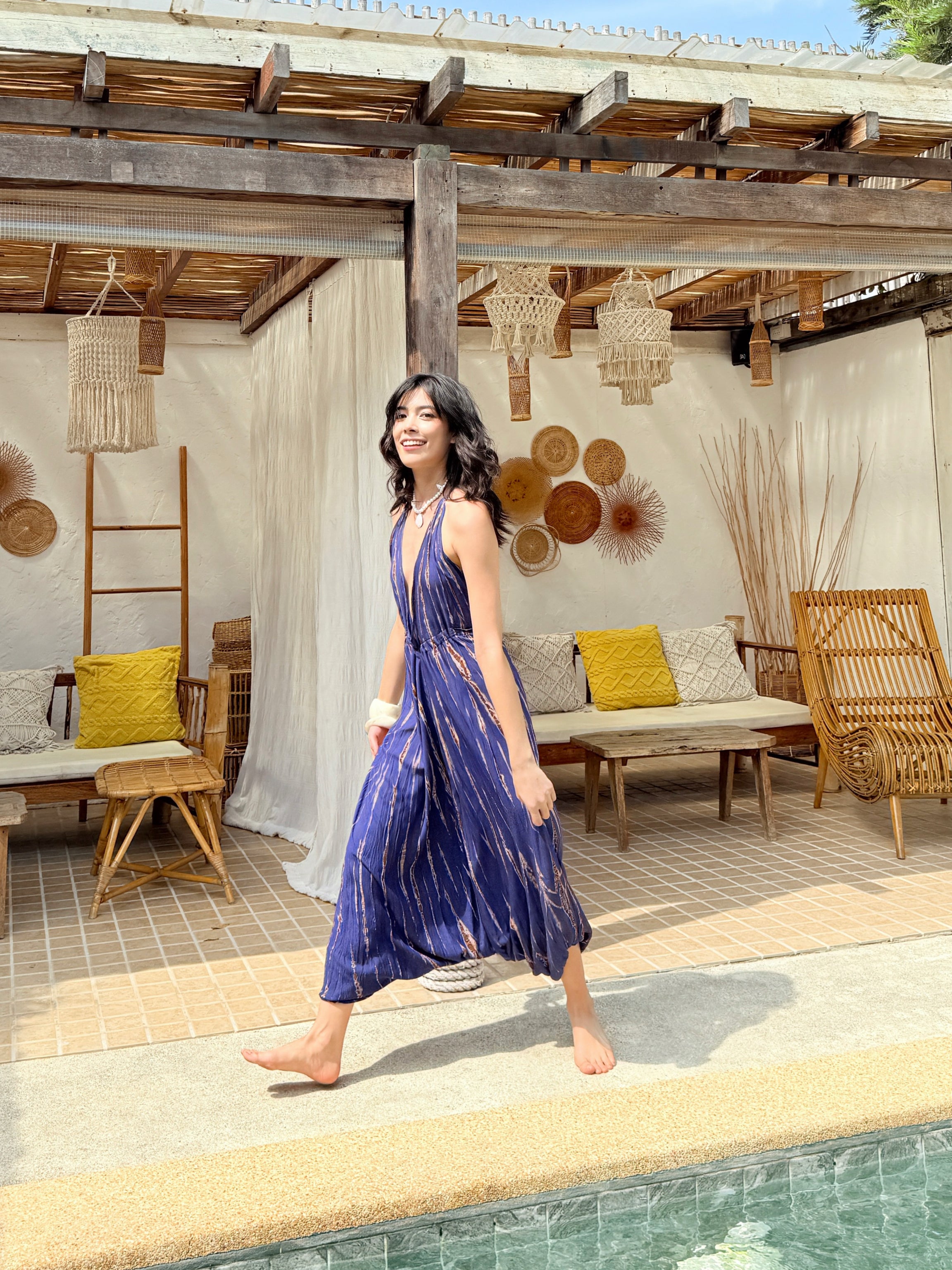 Model wearing Hera Yoga Tie Dye Jumpsuit – flowy activewear for women’s yoga and beach travel.