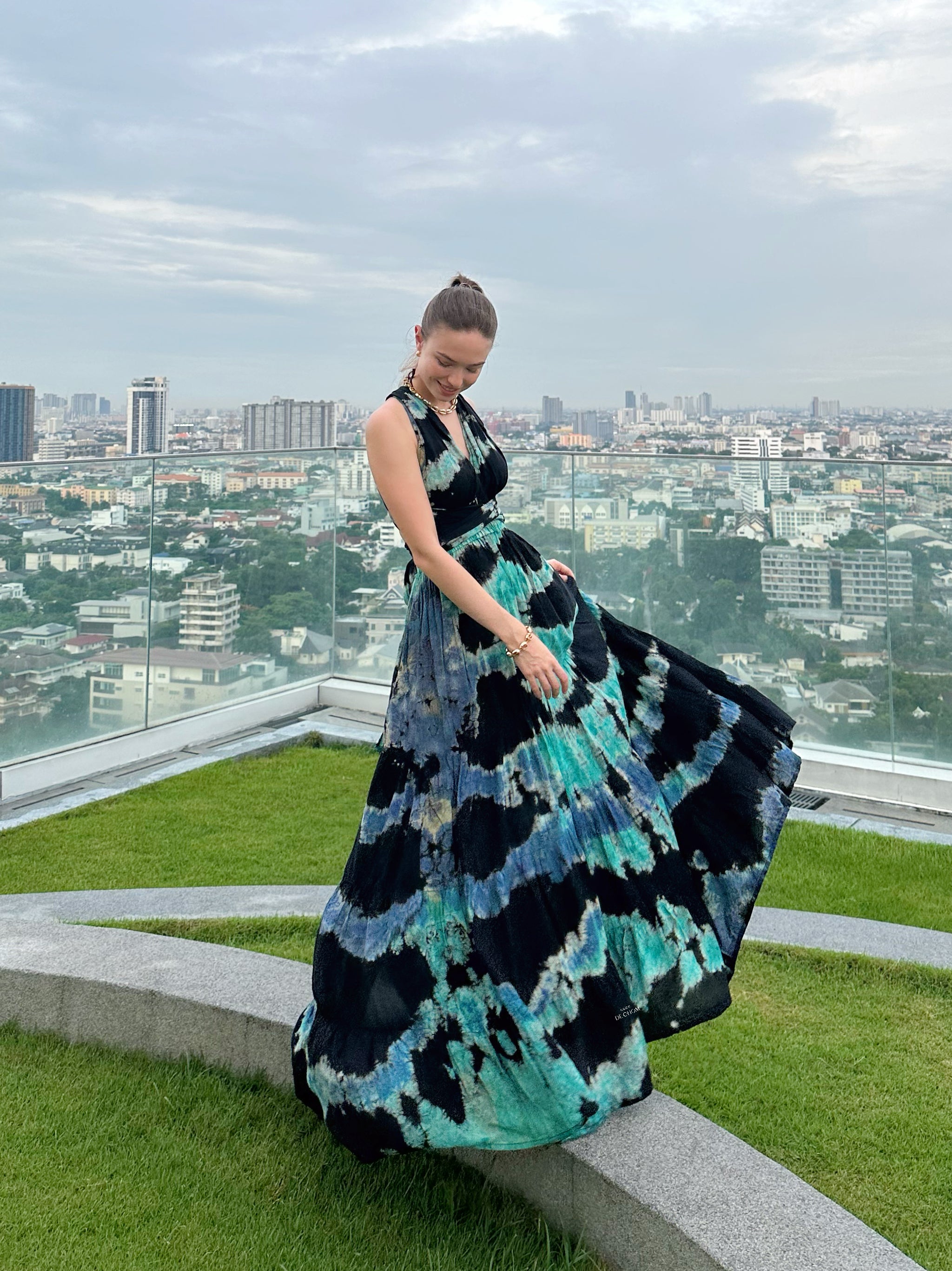 Introducing our Butterfly Infinity Maxi Dress Tie Dye, a limited edition piece that effortlessly blends style and versatility.