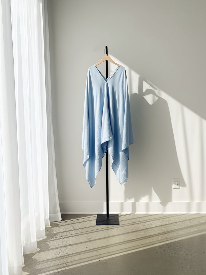 A blue kaftan style tunic top or blue mini kaftan dress hanging perfect beach cover up or resortwear