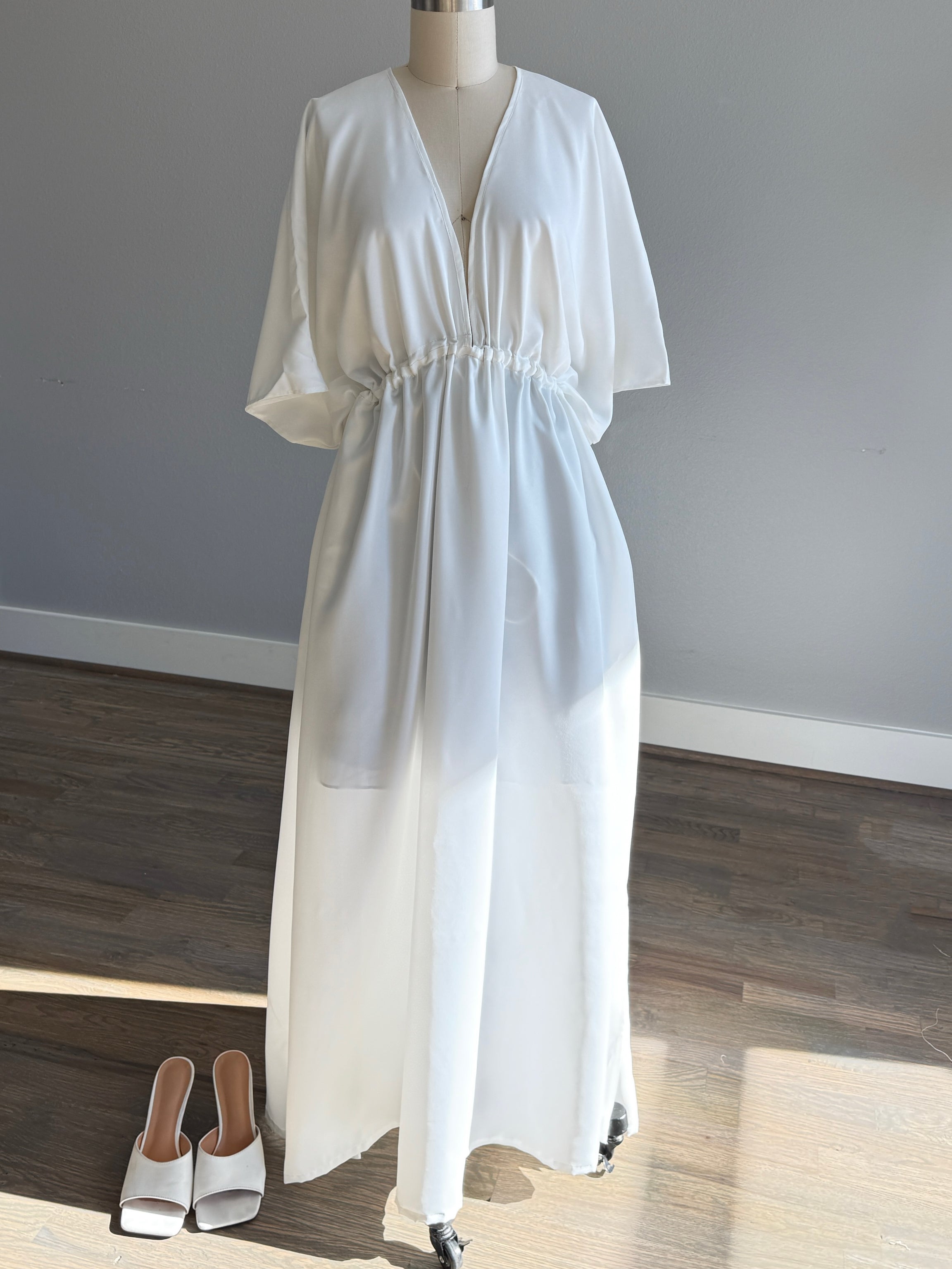 White Maxi Dress in limitless comfort and elegance with our Goddess Kaftan Maxi Dress. With a flowy skirt and a V neck, this modal maxi dress is the perfect vacation wear. 
