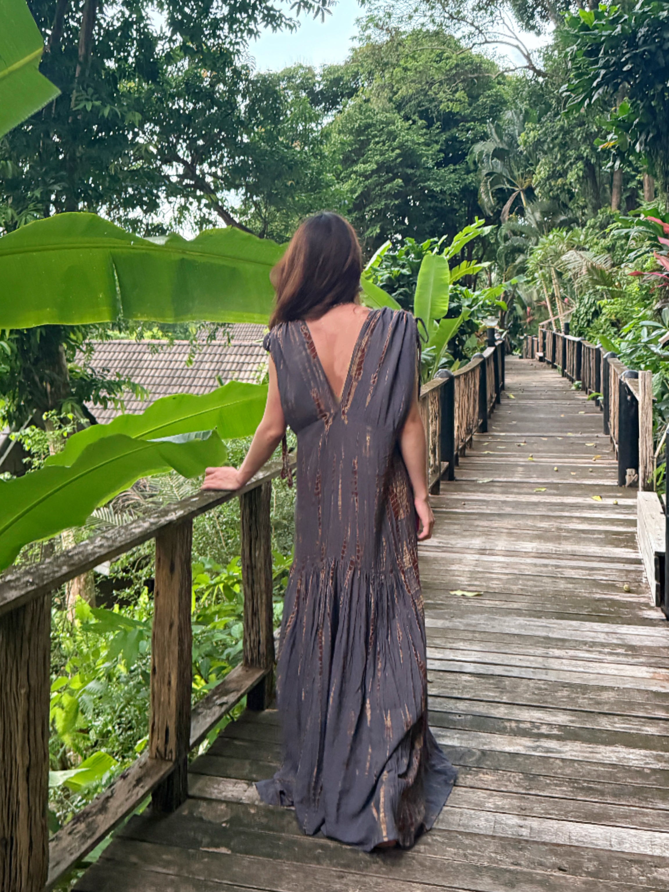 Model wearing the handmade Athena Goddess Kaftan Dress, a tie-dye maxi with pockets, flowy silhouette, and deep V-neckline—perfect for summer dress, beach coverup, resort wear or festivals.
