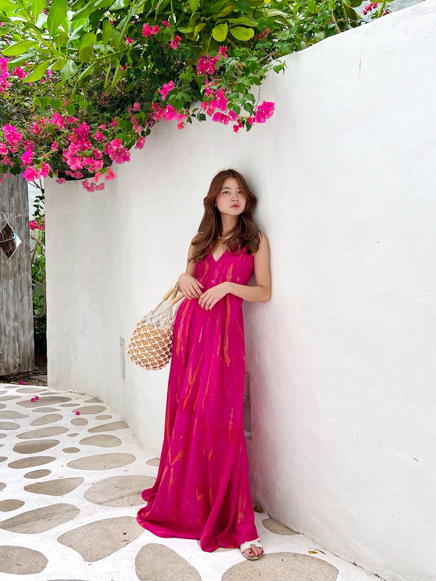 Embrace a bohemian style with our Nomad Tie-Dye Maxi Dress. Featuring an A-line silhouette and a backless design, this floor-length dress is a dream to wear.