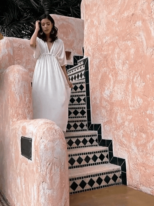 White Kaftan Dress in limitless comfort and elegance with our Goddess Kaftan Maxi Dress. With a flowy boho skirt and a V neck, this modal maxi dress is the perfect vacation wear.