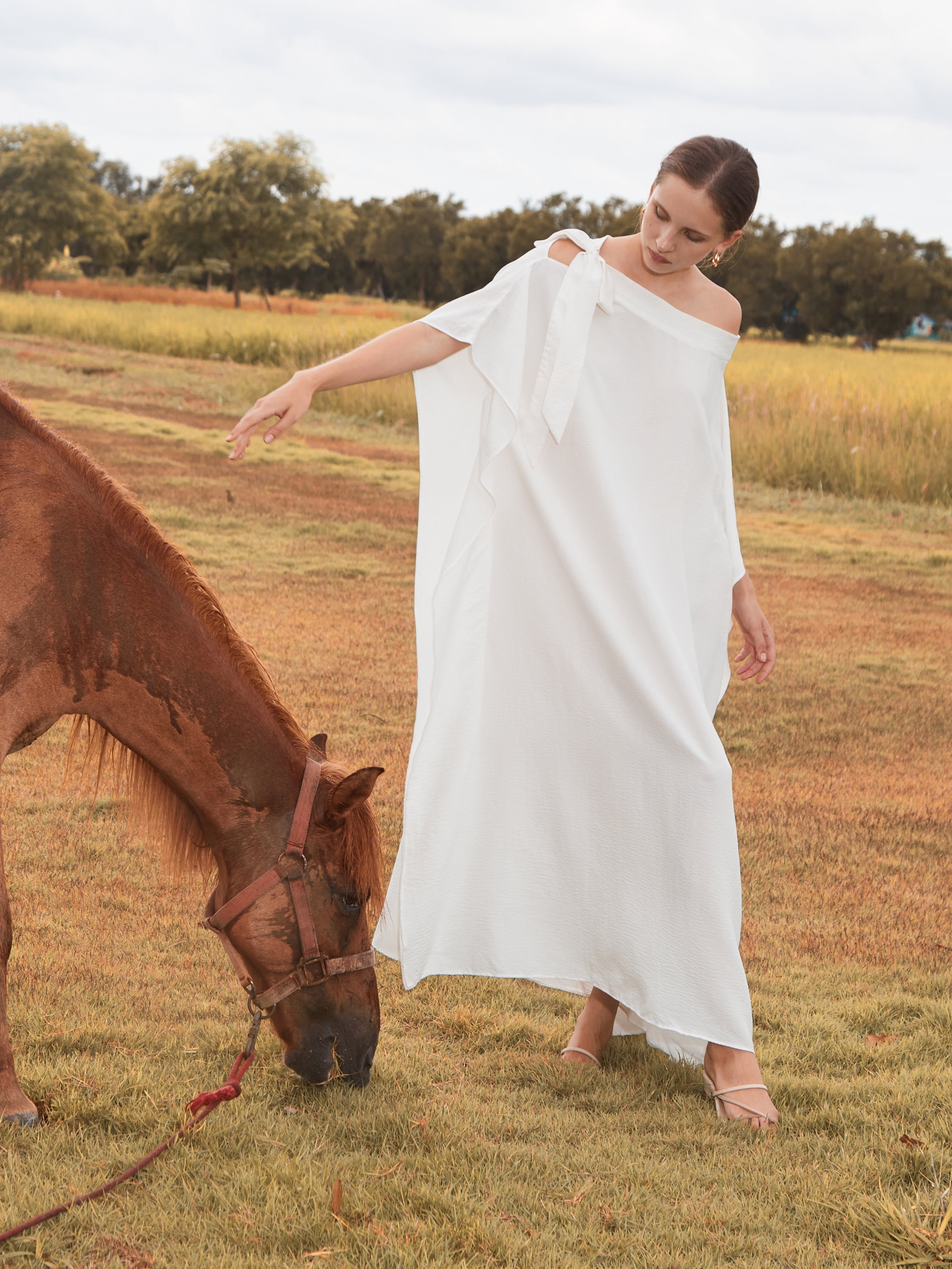 Shop White Kaftan Dress in limitless comfort and elegance with our Goddess Kaftan Maxi Dress. With a flowy skirt and a V neck, this modal maxi dress is the perfect vacation wear.