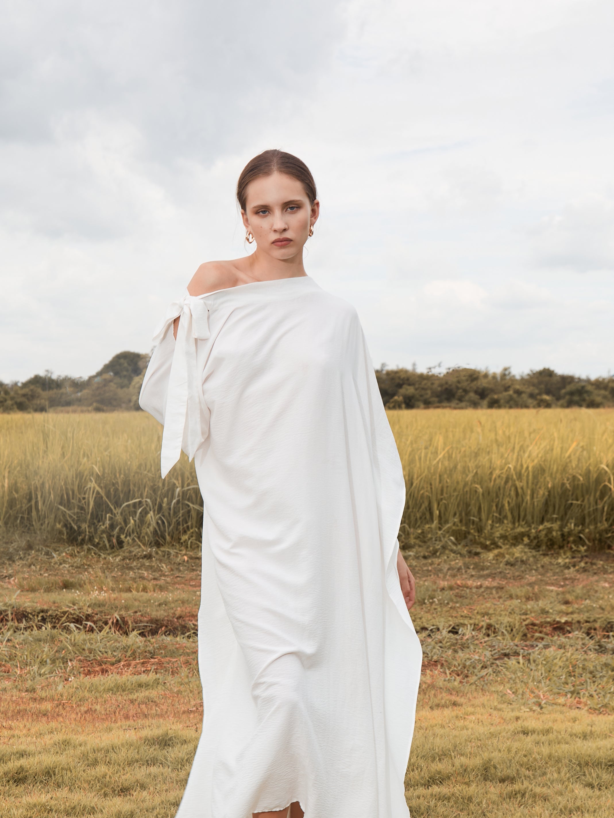 Shop White Kaftan Dress in limitless comfort and elegance with our Goddess Kaftan Maxi Dress. With a flowy skirt and a V neck, this modal maxi dress is the perfect vacation wear.