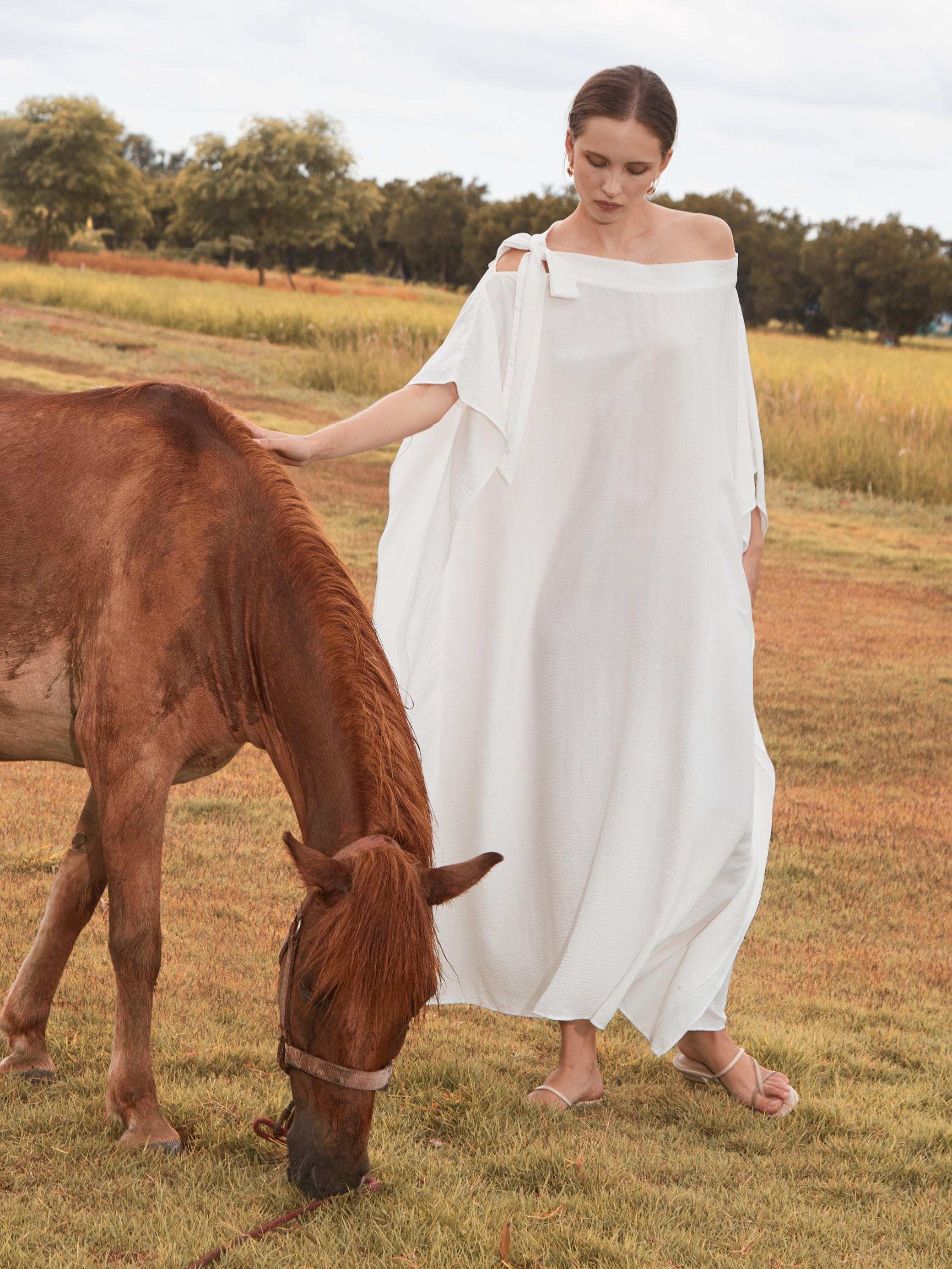 Shop White Kaftan Dress in limitless comfort and elegance with our Goddess Kaftan Maxi Dress. With a flowy skirt and a V neck, this modal maxi dress is the perfect vacation wear.