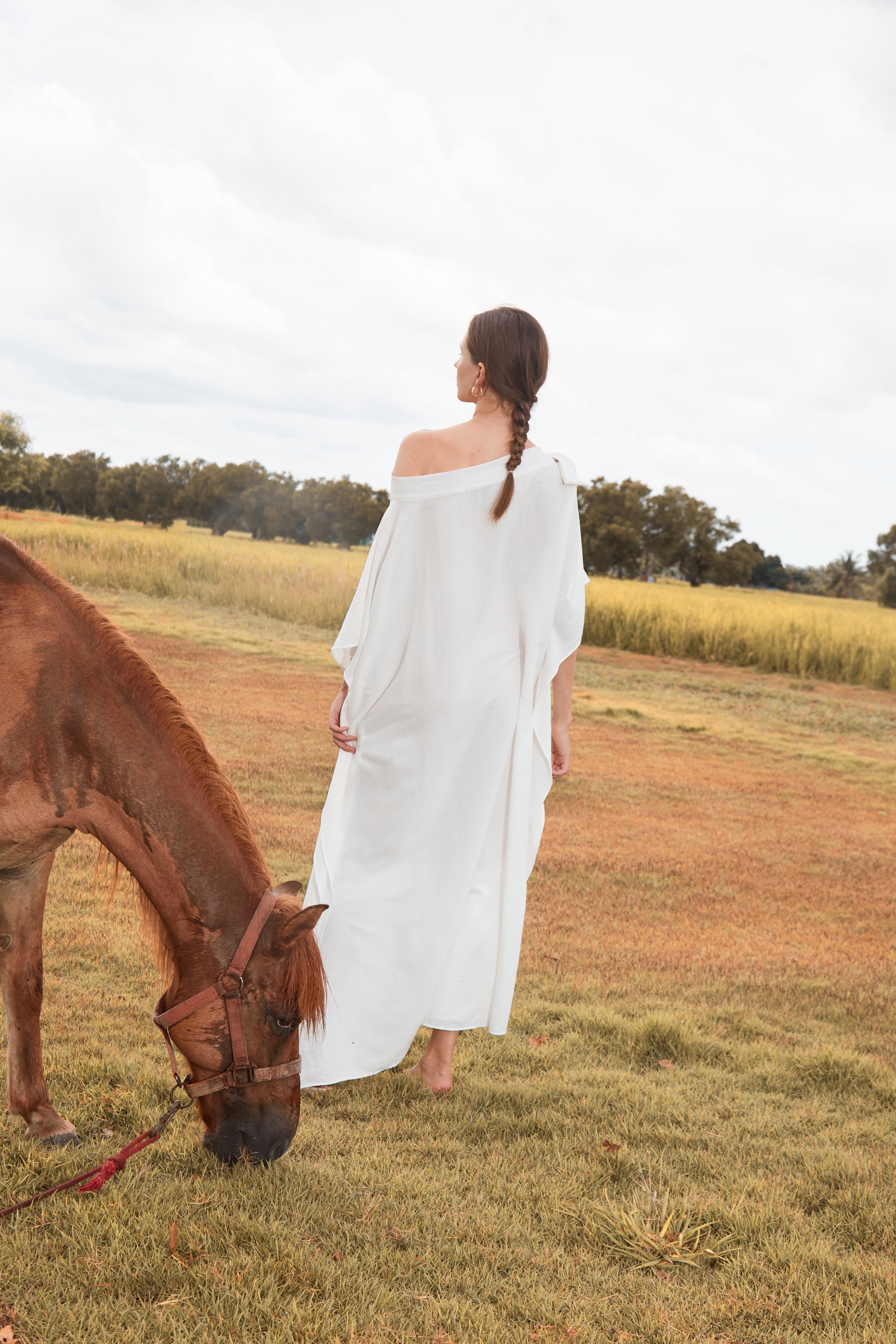 Shop White Kaftan Dress in limitless comfort and elegance with our Goddess Kaftan Maxi Dress. With a flowy skirt and a V neck, this modal maxi dress is the perfect vacation wear.