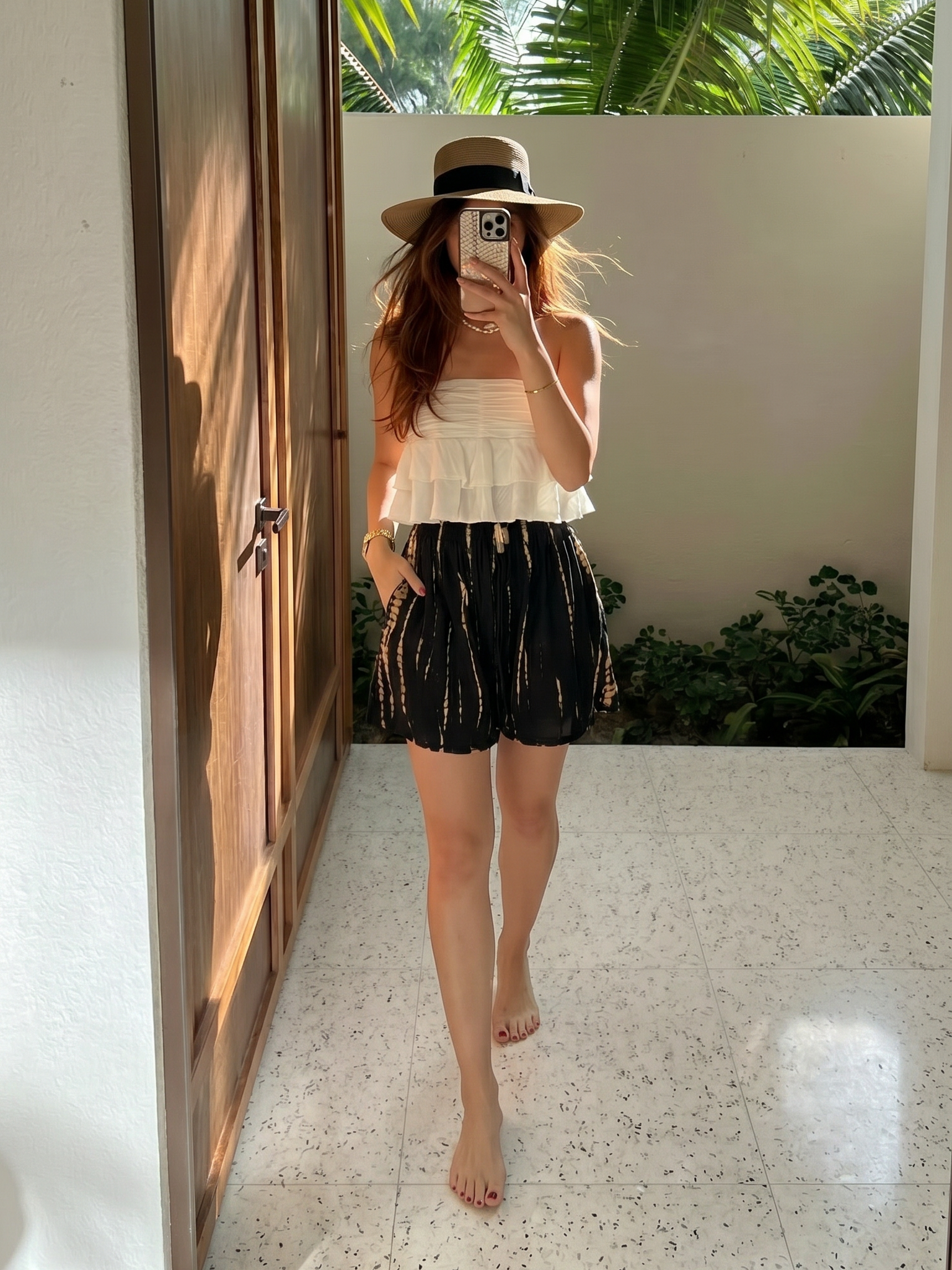 Boho tie dye summer shorts styled for beach days, poolside lounging, resort wear, and warm weather travel