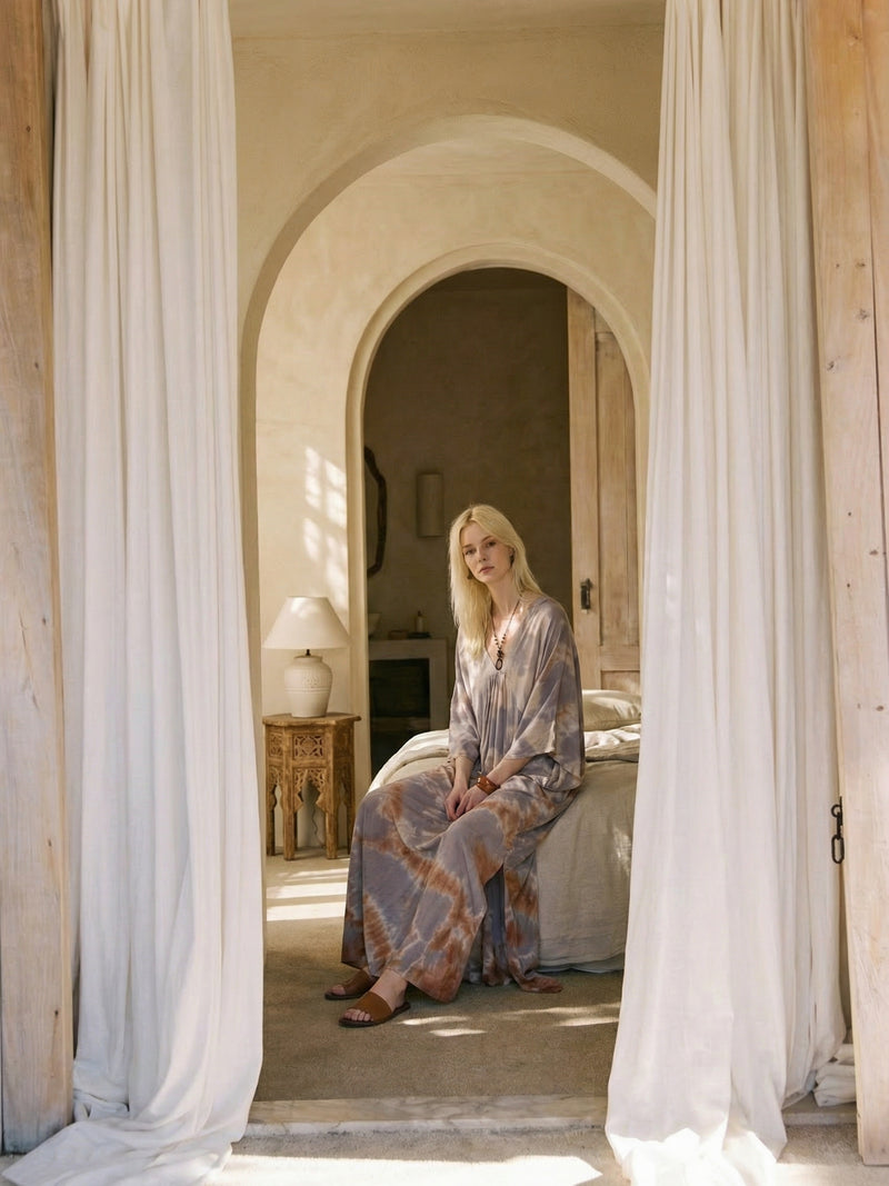 Woman wearing seafoam sand tie dye kaftan maxi dress, flowy resort wear beach cover up, lightweight semi-sheer vacation dress
