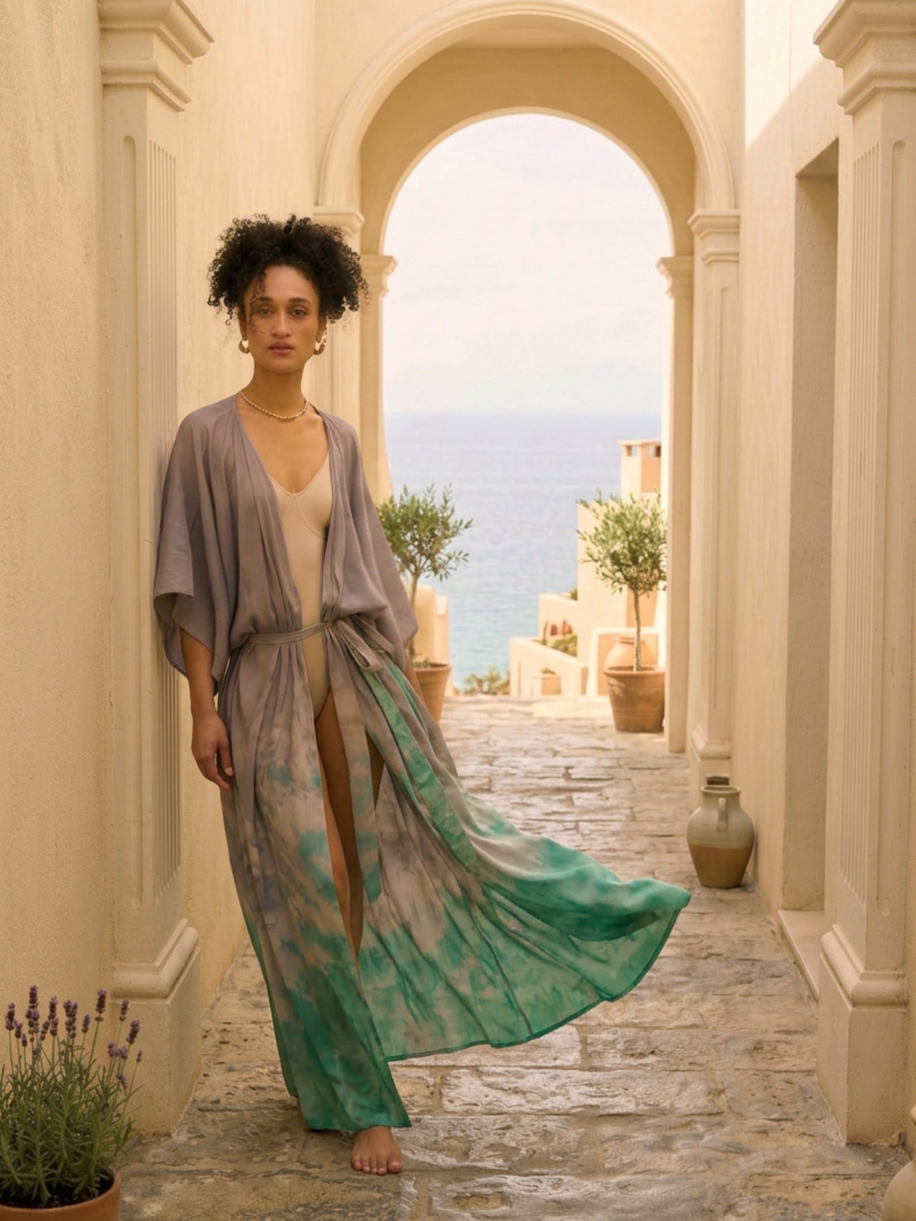 Woman wearing seafoam teal tie dye kaftan kimono as lightweight resort cover up, handmade boho beach robe by COCO DE CHOM