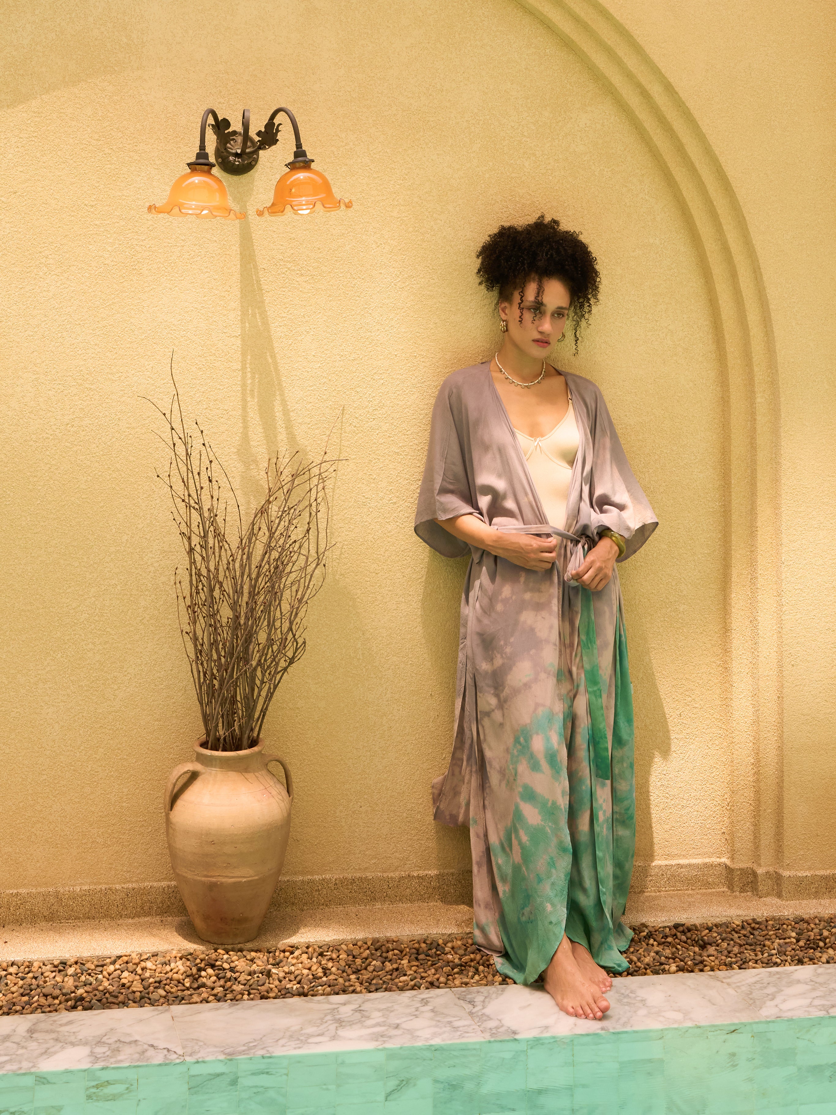 Woman wearing seafoam teal tie dye kaftan kimono as lightweight resort cover up, handmade boho beach robe by COCO DE CHOM