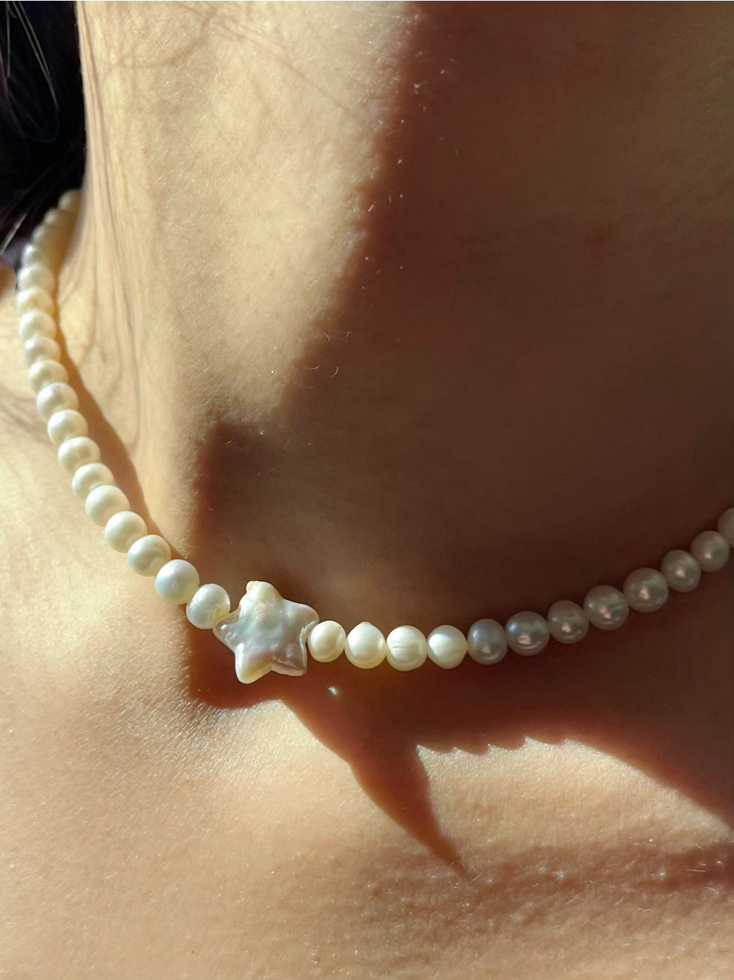 North Star Pearl Choker Necklace is the perfect choice for beach vacation or every day wear. This pearl necklace is made using natural water fresh pearl for both the star pendant and necklace for understated elegance. 