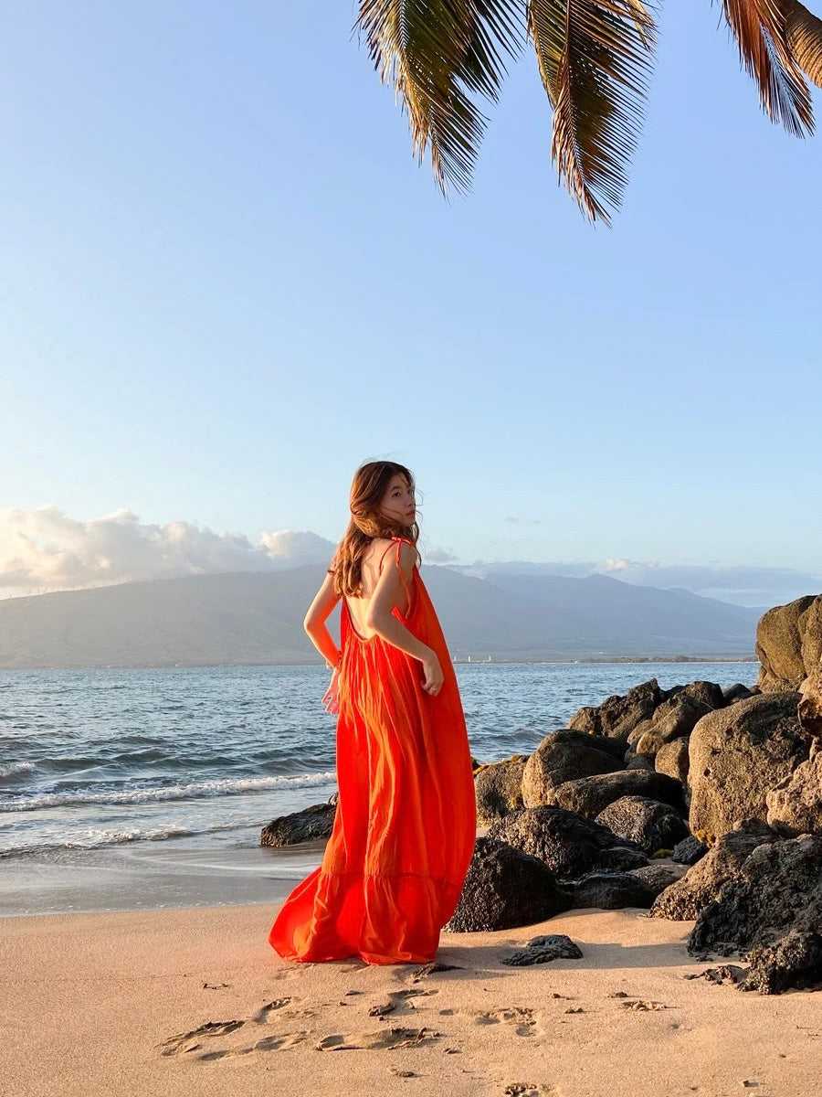 Unleash your inner fashionista with our Orange Backless Maxi Dress from Mali Dress Collection