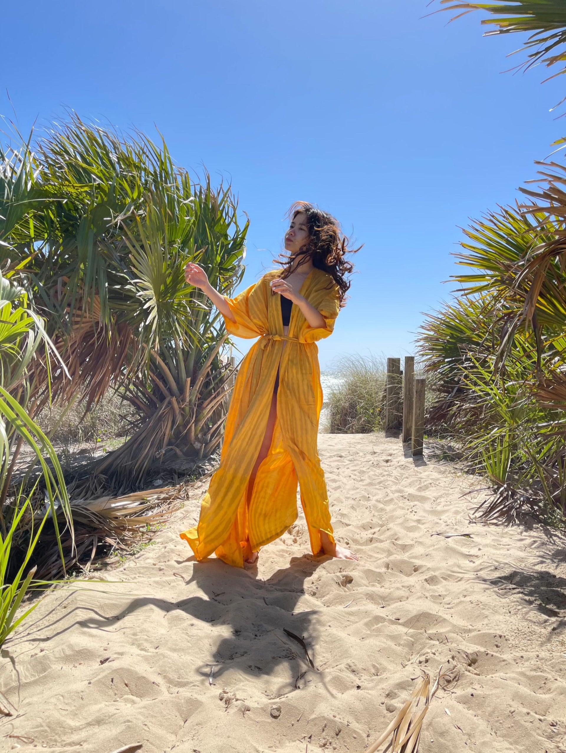 A beautiful unisex kimono, the Moon Tie Dye Kaftan Kimono is handcrafted from 100% soft rayon and features side slits at the hemline and inner loops between wings complemented by breezy sleeves, a basic for remaining cool as temperatures soar. Slip the chic kimono robe over a bikini